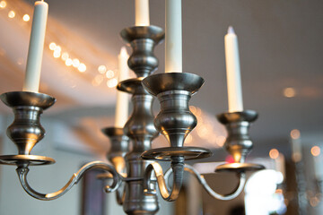 Fototapeta premium Decorative Brass candle lamp hanging from ceiling