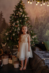 Beautiful little girl having fun while spending Christmas at home