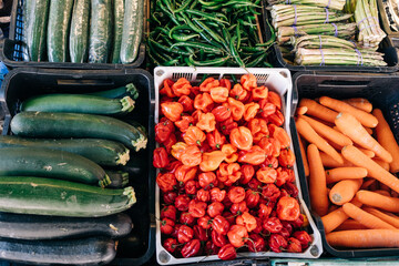 Stall of organic vegetables and fruits at a farmers market. Selling organic.