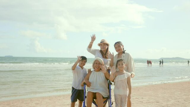 Asian Big Family At The Beach. Multigenerational Concept