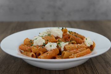 Baked Italian noodles with cheese toppings fills the bowl for a complete meal