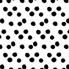 Vector pattern of round spots. Black on a white background. Calligraphic style. Brush strokes. Doodle. Hand drawing