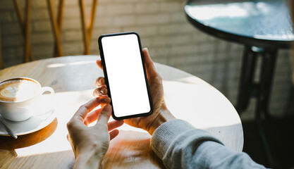 cell phone blank white screen mockup.woman hand holding texting using mobile on desk at office.background empty space for advertise.work people contact marketing business,technology