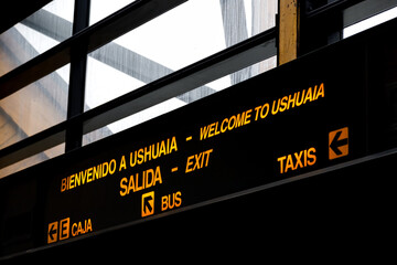 Close-up of welcome and information sign at Ushuaia Airport, Argentina
