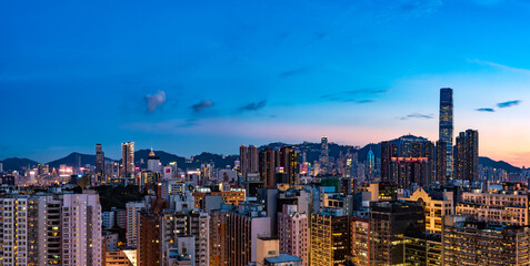 Fototapeta na wymiar Hong Kong / China - July 2017: Ultra wide image of Hong Kong cityscape at dusk.