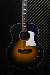 Fototapeta premium guitar standing on studio background