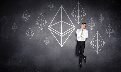 Image of pyramid and businessman against black background