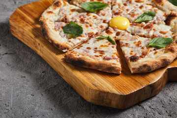 Carbonara pizza with bacon and eggs