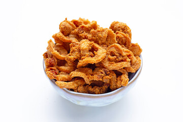 Fried crispy pork belly recipe in bowl on white background.