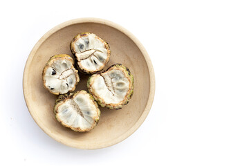 Custard apple in plate on white background.