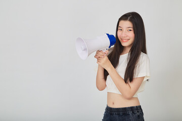 young pretty Asian woman holding megaphone