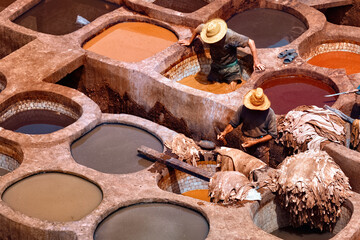 Unknown wokers in the tannery in Fez, Morocco. The tanning industry in the city is considered one...