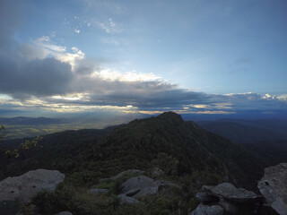 Sunlight shines through the cloud only in some areas and in the areas covered by the cloud, thus making it dark.
