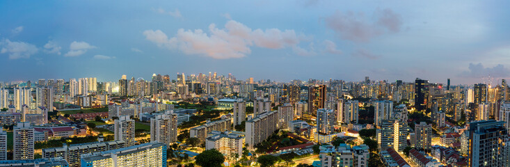 Fototapeta na wymiar Ultra wide panorama image of Singapore skyscrapers at magic hour.