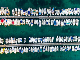 Aerial Top View Yachts and Sailboats Moored in Marina on a Turquoise Water. Drone Top Down View
