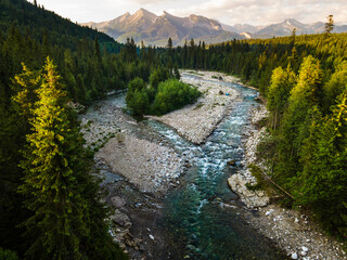 Fototapeta na wymiar Bialka River in Tatra Mountains at Sunrise. Sccenic Outdoors in Poland from Drone