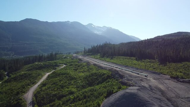 Aerial Footage Of A Section Of Pipeline Under Construction In A Mountain Valley