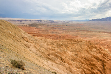 Boguty Mountains, also called "Red Mountains", in Kazakhstan. Summer view of the red mountains landscape.