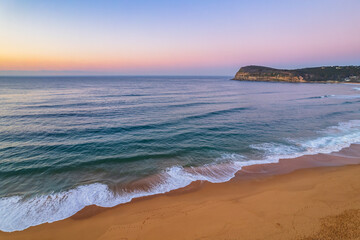 Clear skies aerial sunrise at the beach