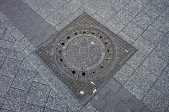 Cologne, Germany - May 21, 2018: Deutschland, HIGH ANGLE VIEW OF MANHOLE ON STREET