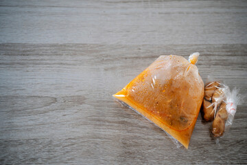 Food made from coconut milk and spices in the plastic bag