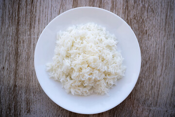 Jasmine rice on the wooden background table