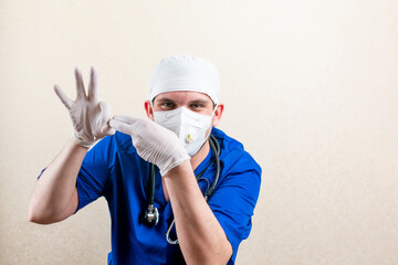 Urologist in mask and gloves. On a light background.