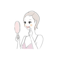 鏡で歯をチェックする女性