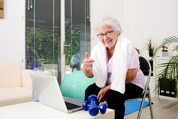 portrait of an active and dynamic senior woman doing sport fitness at home