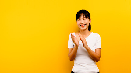 congratulation portrait of an asian woman with joy clapping in the show Fun applause. Cheerful...