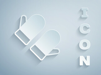Paper cut Christmas mitten icon isolated on grey background. Merry Christmas and Happy New Year. Paper art style. Vector