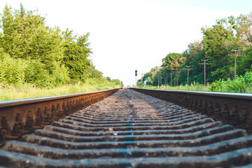 The railway going into the distance. Iron empty long rails.