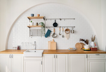 New Modern white light interior of kitchen with white furniture, dining table.Minimal style of...
