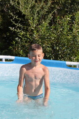 child playing in the pool