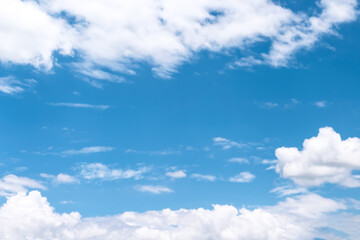 Fototapeta na wymiar White clouds on bright blue sky background and vast space