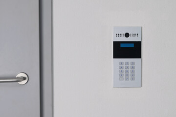 intercom with video communication in the wall for opening the door to the hall
