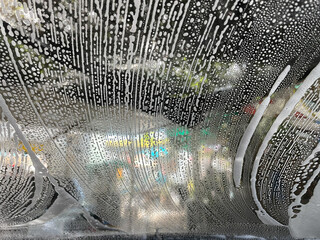 Bubble water on the windshield for cleaning.