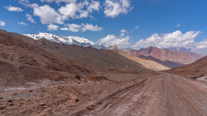 Fototapeta na wymiar Colorful high altitude landscape of Pamir Highway at Kyzyl Art pass in Trans-Alai or Trans-Alay mountain range between Tajikistan and Kyrgyzstan borders