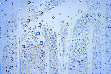 Fototapeta na wymiar drops glass blue background abstract, transparent cold background water splashes