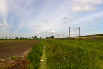 Railroad track along meadows in the Zuidplaspolder