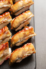 Seasoned eel sushi on a plate