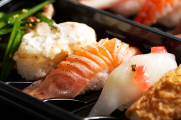 Various types of sushi in packaging