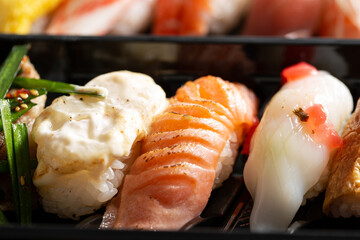 Various types of sushi in packaging © mnimage