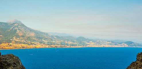 Alanya panorama at sunset overlooking the Mediterranean seaport and mountains