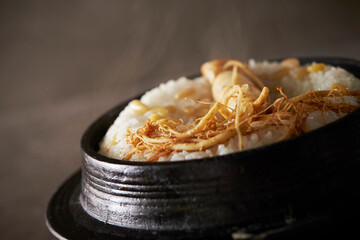 Ripe ginseng on cast iron pot rice