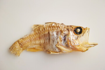 small dried fish on a white background