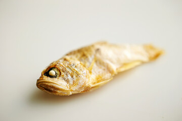 small dried fish on a white background