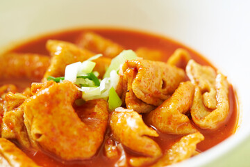 Spicy fish cake soup in a bowl 
