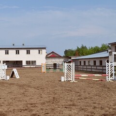 empty show jumping arena with obstacles and start mark , barriers and poles, horse riding,...