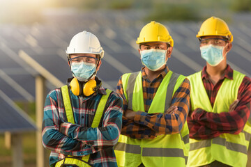 Portrait of three engineers on a construction site wearing face masks, Thailand